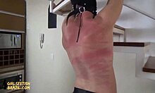 A strict redhead mistress punishes her girlfriend in femdom video